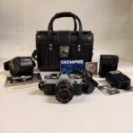 Canon AE-1 35mm SLR Film Camera w/ FD 50mm f/1.8 Lens Flash Bag Tested Kit