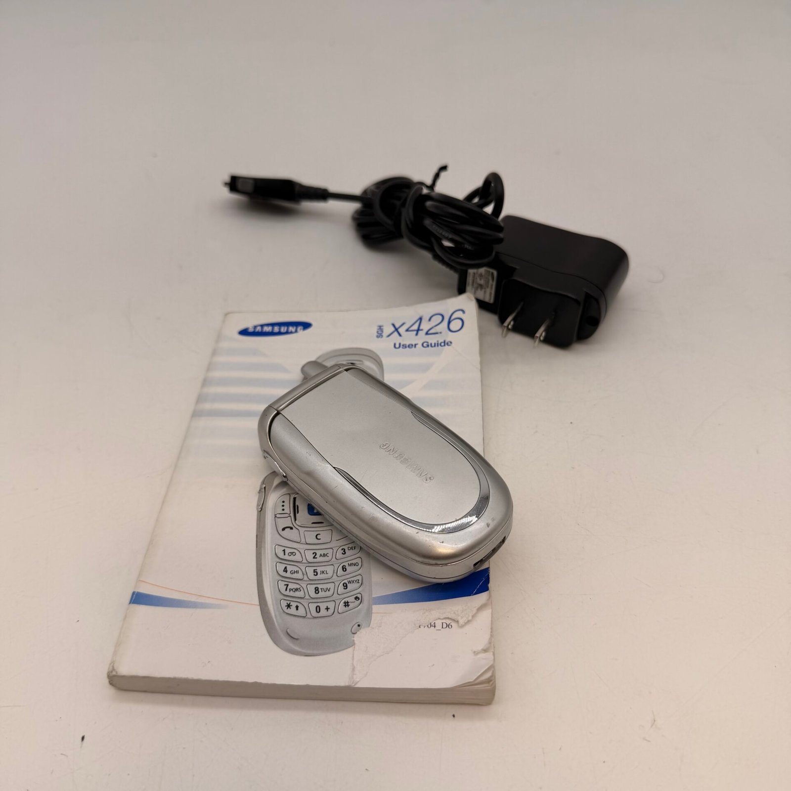 IMG_7299 Vintage Samsung SGH-X426 Flip Phone Silver w/ OEM Charger Manual Untested - Image 1